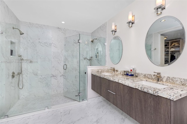 bathroom featuring vanity and a shower with shower door