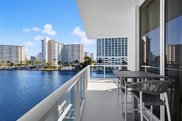 balcony featuring a water view