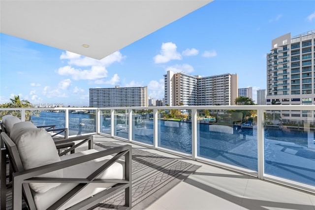 balcony featuring a water view