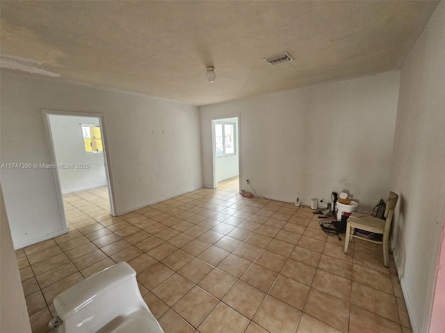 view of tiled spare room