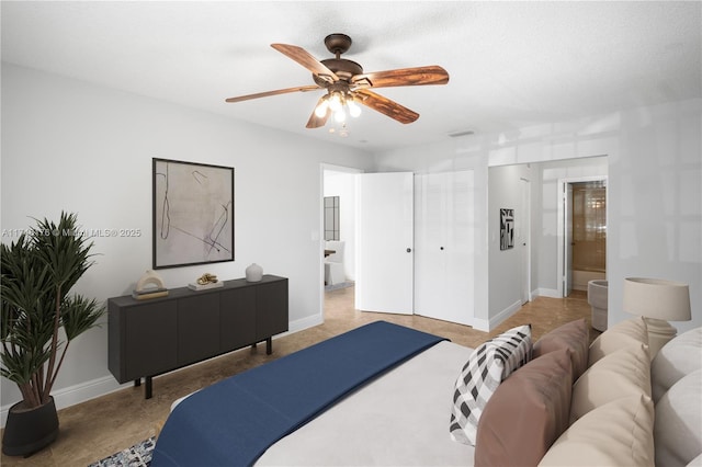 bedroom with baseboards and a ceiling fan