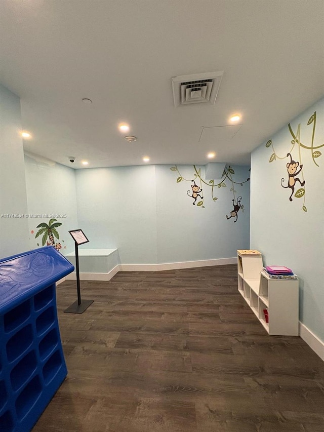 interior space featuring recessed lighting, visible vents, baseboards, and wood finished floors