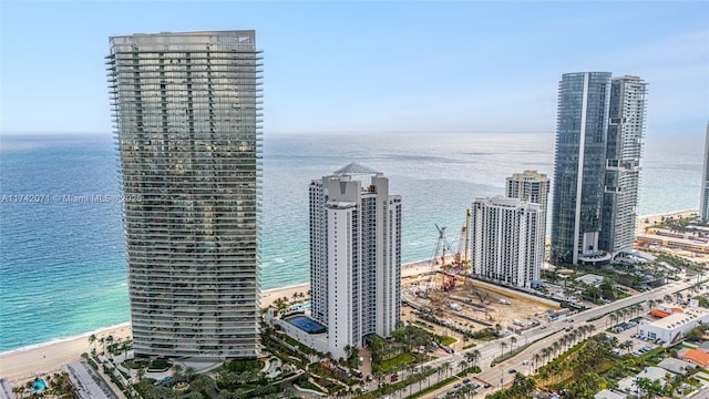 view of water feature with a city view and a view of the beach