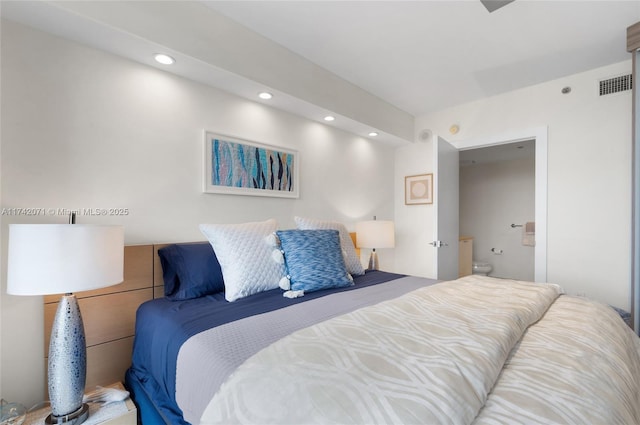 bedroom featuring visible vents, connected bathroom, and recessed lighting