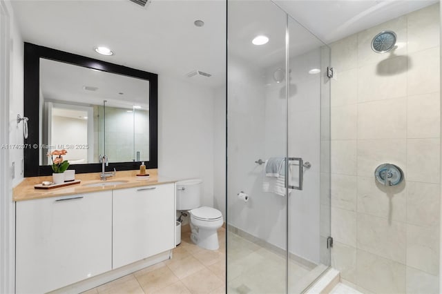 full bath with visible vents, toilet, tile patterned flooring, vanity, and a shower stall