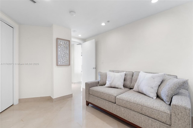 living area with recessed lighting and baseboards