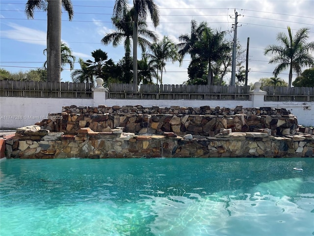 view of swimming pool featuring pool water feature