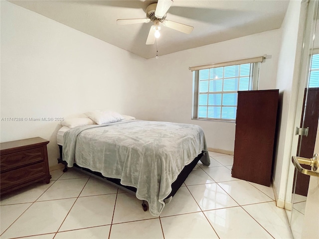 bedroom featuring ceiling fan and light tile patterned floors