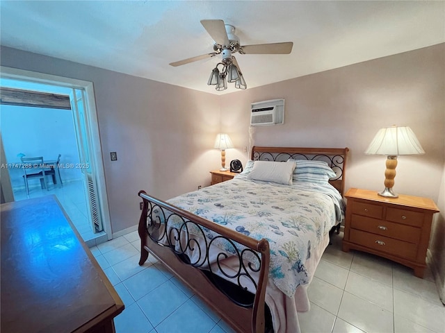 bedroom with light tile patterned floors, ceiling fan, and a wall unit AC