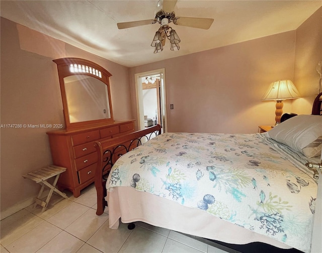 tiled bedroom with ceiling fan