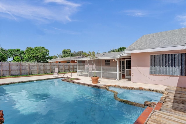 view of pool with a patio and a sunroom