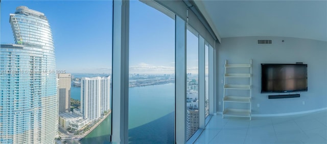 balcony featuring a water view