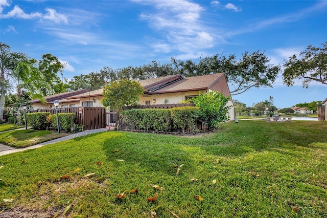 ranch-style home with a front yard