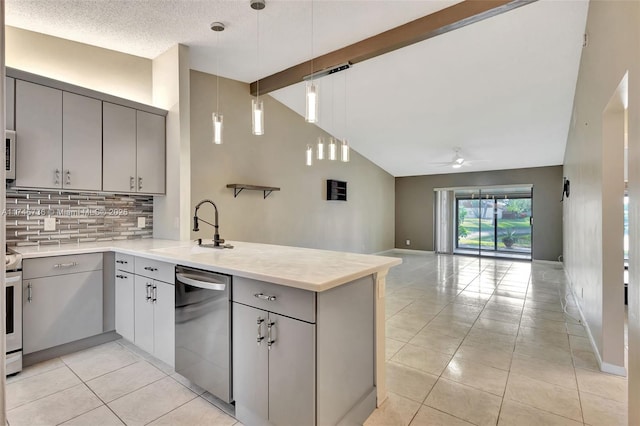 kitchen featuring stainless steel dishwasher, sink, hanging light fixtures, and kitchen peninsula