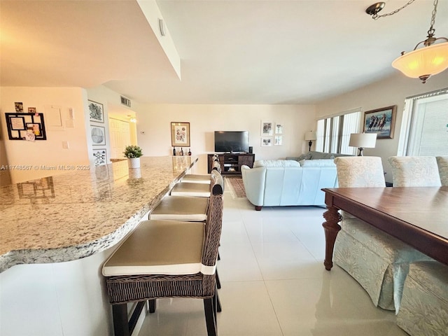 living room featuring light tile patterned floors