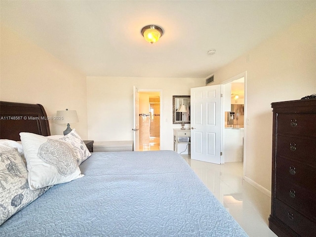 bedroom featuring ensuite bath