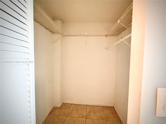 spacious closet featuring tile patterned floors