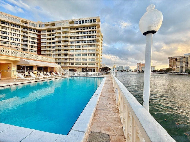 pool featuring a water view and a city view
