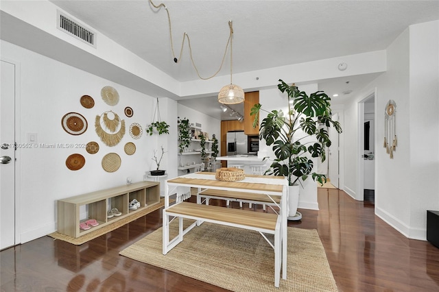 dining space with dark wood-type flooring