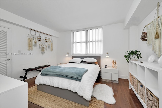 bedroom featuring dark hardwood / wood-style flooring