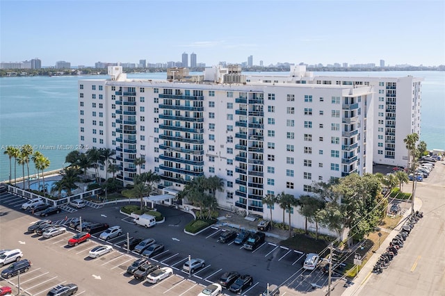 birds eye view of property with a water view