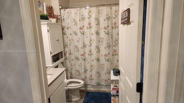 full bathroom with vanity, toilet, and shower / tub combo