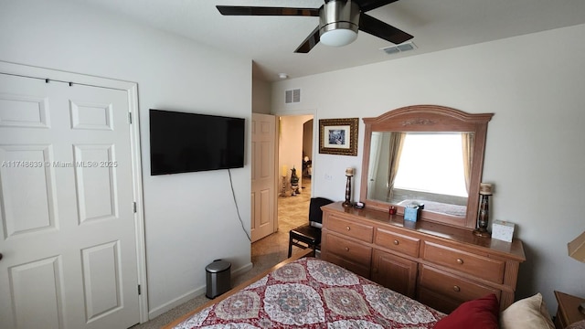 carpeted bedroom with ceiling fan