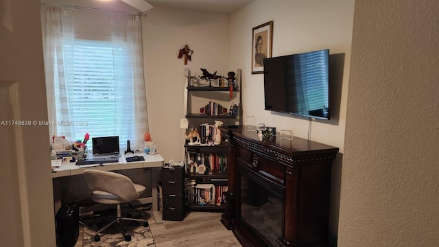 office space with light hardwood / wood-style flooring