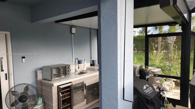 bathroom featuring sink and beverage cooler