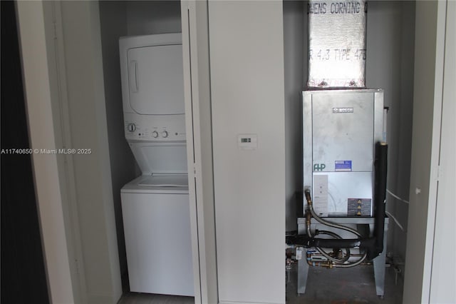 laundry room featuring laundry area and stacked washer and clothes dryer