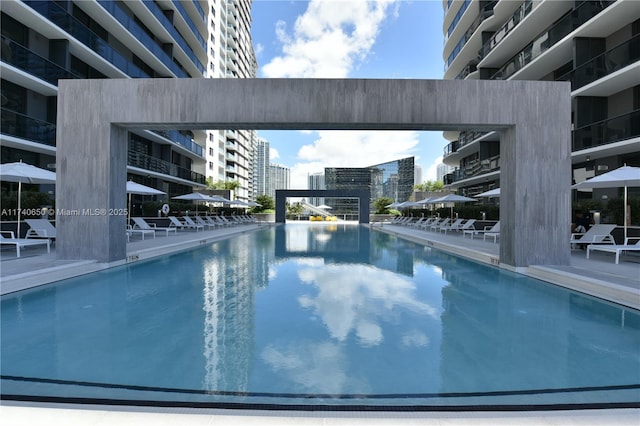 view of pool with a city view