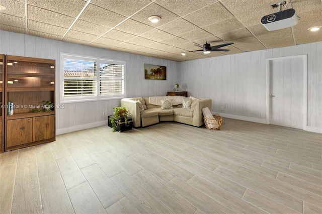 living room featuring ceiling fan and light wood-type flooring