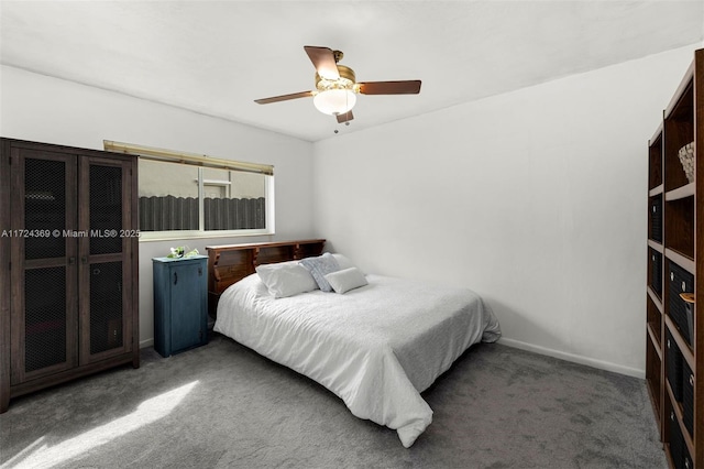 bedroom with dark carpet and ceiling fan