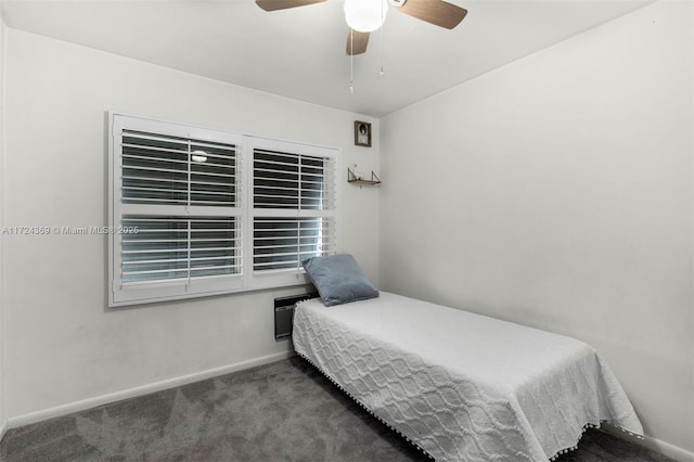 carpeted bedroom featuring a ceiling fan and baseboards