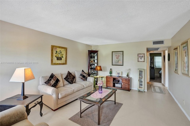 235 Kent N Unit 235, West Palm Beach, FL 33417 - living room with baseboards, a textured ceiling, and visible vents