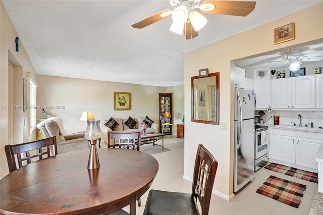 235 Kent N Unit 235, West Palm Beach, FL 33417 - dining space featuring ceiling fan and light tile patterned flooring