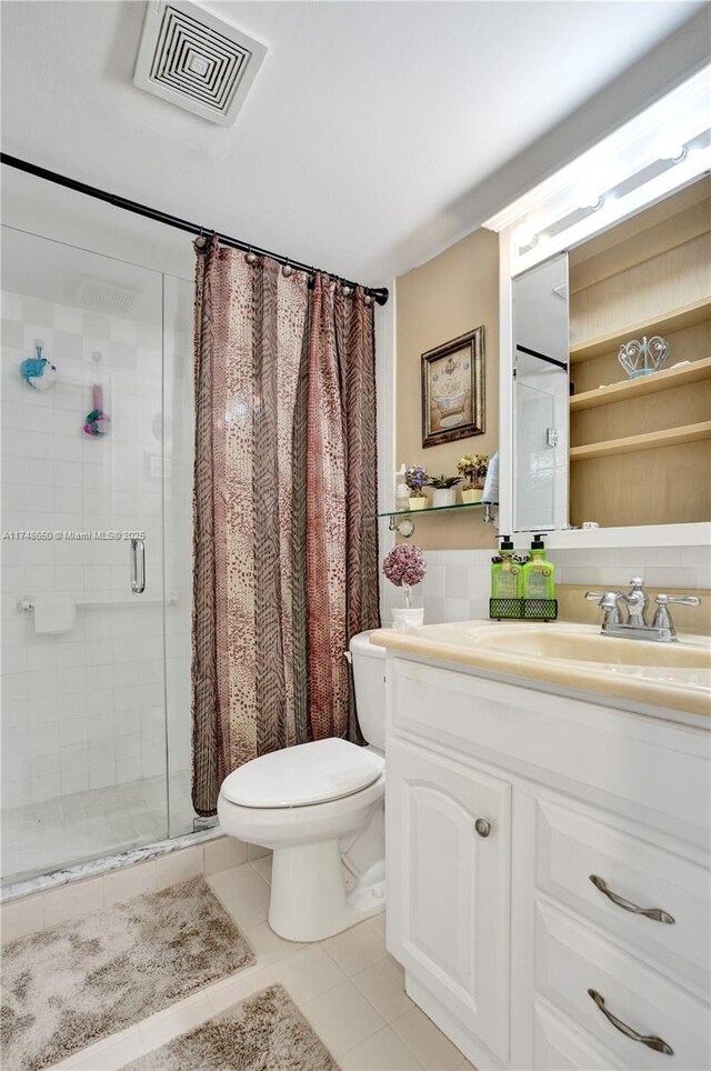 235 Kent N Unit 235, West Palm Beach, FL 33417 - full bath with visible vents, a stall shower, vanity, tile patterned floors, and toilet