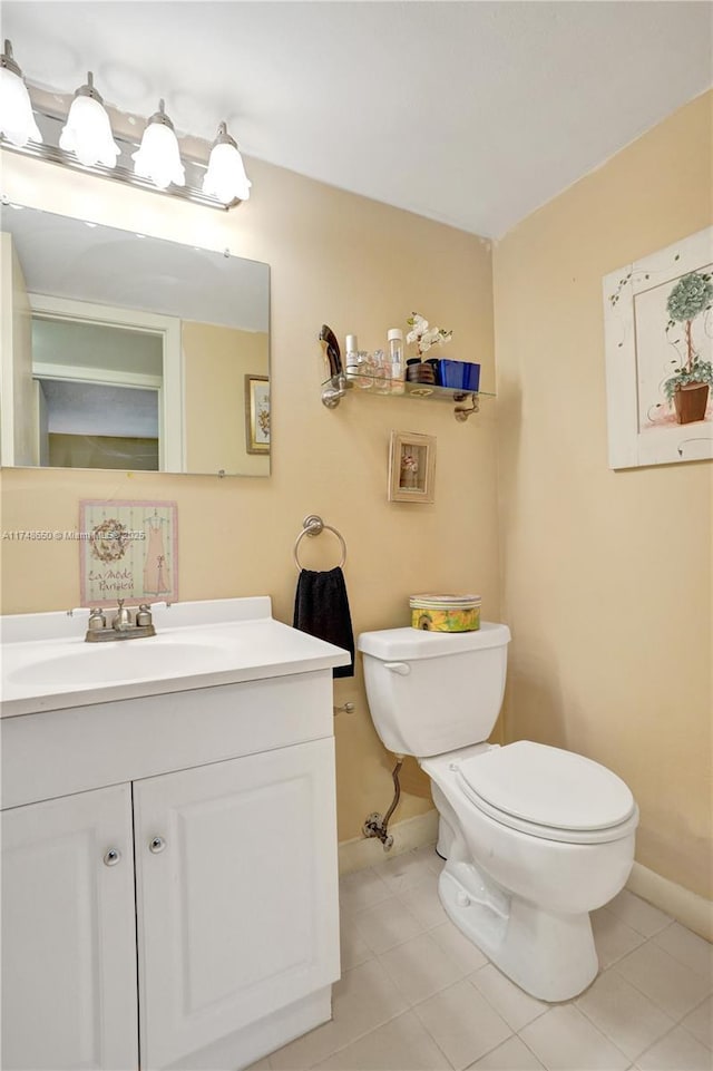 235 Kent N Unit 235, West Palm Beach, FL 33417 - half bath featuring baseboards, tile patterned floors, toilet, and vanity