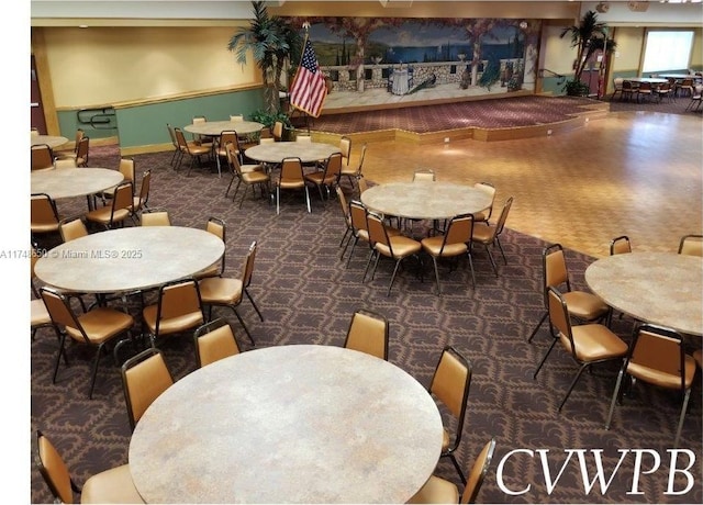 235 Kent N Unit 235, West Palm Beach, FL 33417 - carpeted dining space featuring baseboards