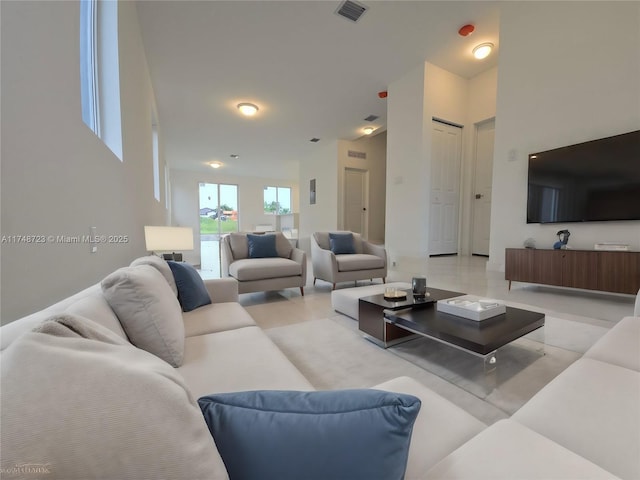 living room featuring visible vents