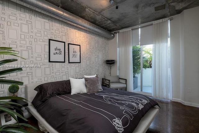 bedroom featuring wallpapered walls, access to outside, and baseboards