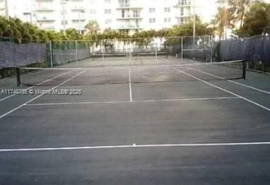 view of sport court with fence