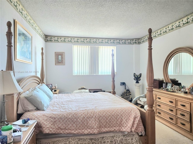 carpeted bedroom featuring a textured ceiling