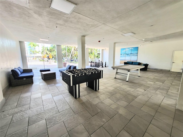 game room featuring expansive windows and a wealth of natural light