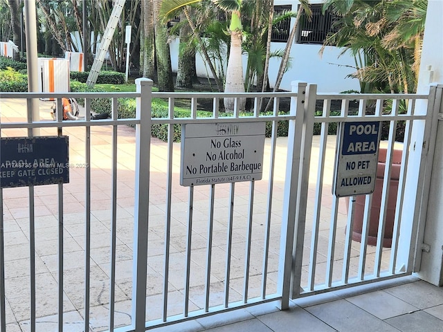 view of gate featuring fence