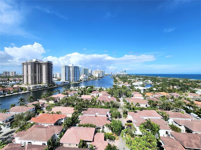 aerial view featuring a water view, a residential view, and a city view