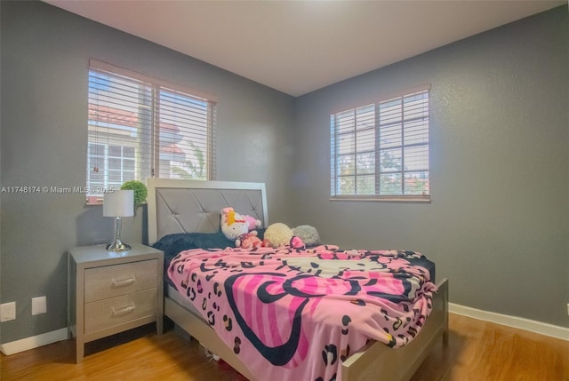 21119 NW 14th Pl Unit 437, Miami Gardens, FL 33169 - bedroom with light wood-type flooring and baseboards