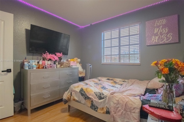 bedroom with wood finished floors