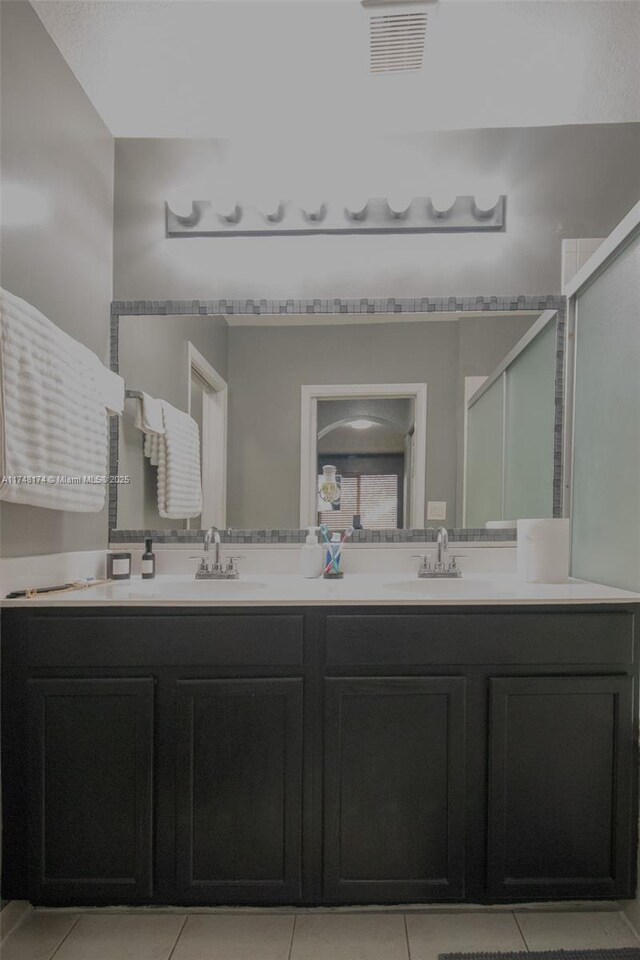 21119 NW 14th Pl Unit 437, Miami Gardens, FL 33169 - bathroom with double vanity, tile patterned flooring, and an enclosed shower