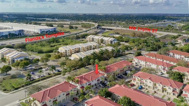 birds eye view of property with a residential view